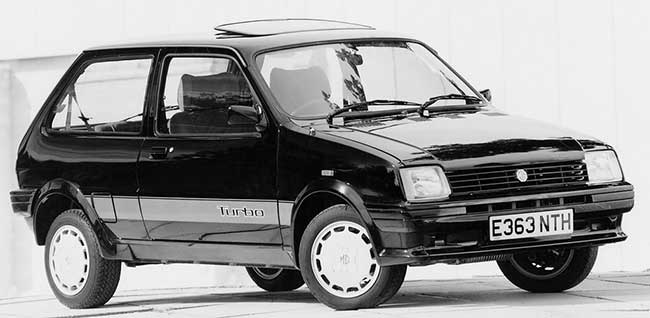 mg metro turbo, metro turbo, mg metro deportivo, austin metro turbo, mg metro 1.3 turbo, mg metro turbo historia, mg metro turbo características, mg metro turbo ficha técnica, mg metro turbo prestaciones, mg metro turbo curiosidades, mg metro turbo sonido motor, mg metro turbo interior, mg metro turbo exterior, mg metro turbo restauración, mg metro turbo mantenimiento, mg metro turbo fiabilidad, mg metro turbo coleccionistas, mg metro turbo clásico moderno, historia del mg metro turbo, evolución del mg metro deportivo, diferencias entre mg metro turbo y metro gta, mg metro turbo frente al renault 5 gt turbo, por qué el mg metro turbo es un coche de culto, curiosidades del mg metro turbo, coches británicos deportivos, coches de los 80, hot hatch clásico, hatchback turbo, coches icónicos de mg, coches de culto, coches con alma, turbo clásico, compactos deportivos clásicos