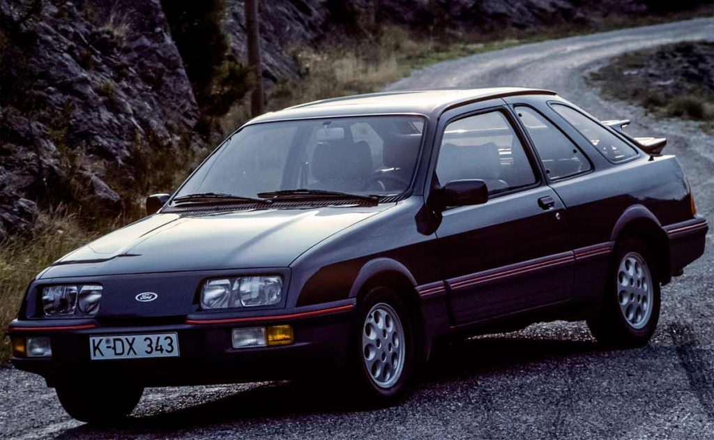 ford sierra xr4i, sierra xr4i v6, ford sierra xr4i, ford sierra deportivo, ford sierra xr4i 2.8 v6, ford sierra xr4i 1983, ford sierra coupé xr4i, ford sierra tracción trasera, ford sierra xr4i historia, ford sierra xr4i características, ford sierra xr4i ficha técnica, ford sierra xr4i prestaciones, ford sierra xr4i curiosidades, ford sierra xr4i sonido motor, ford sierra xr4i interior, ford sierra xr4i exterior, ford sierra xr4i restauración, ford sierra xr4i mantenimiento, ford sierra xr4i fiabilidad, ford sierra xr4i coleccionistas, ford sierra xr4i clásico moderno, historia del ford sierra xr4i, evolución del ford sierra deportivo, diferencias entre sierra xr4i y xr4x4, ford sierra xr4i frente al opel manta gsi, por qué el ford sierra xr4i es un coche de culto, curiosidades del ford sierra xr4i, coches deportivos de los 80, coupés deportivos clásicos, coches icónicos de ford, ford motorsport, coches de culto, coches con alma, v6 clásico, tracción trasera clásica
